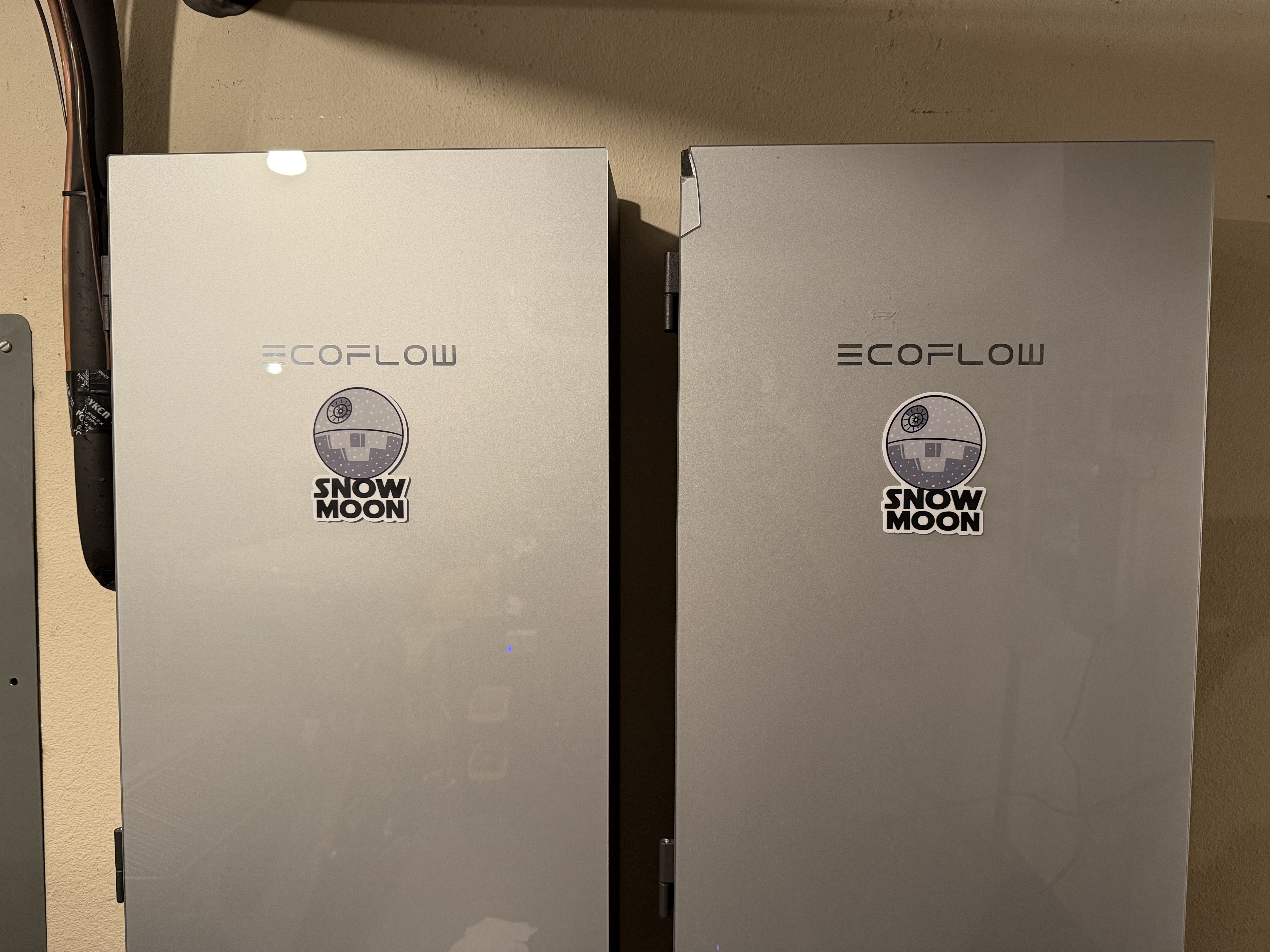 Two EcoFlow Smart Home Panel cabinets side-by-side, each with a hand-applied Death Star sticker and "SNOW MOON" text below it.