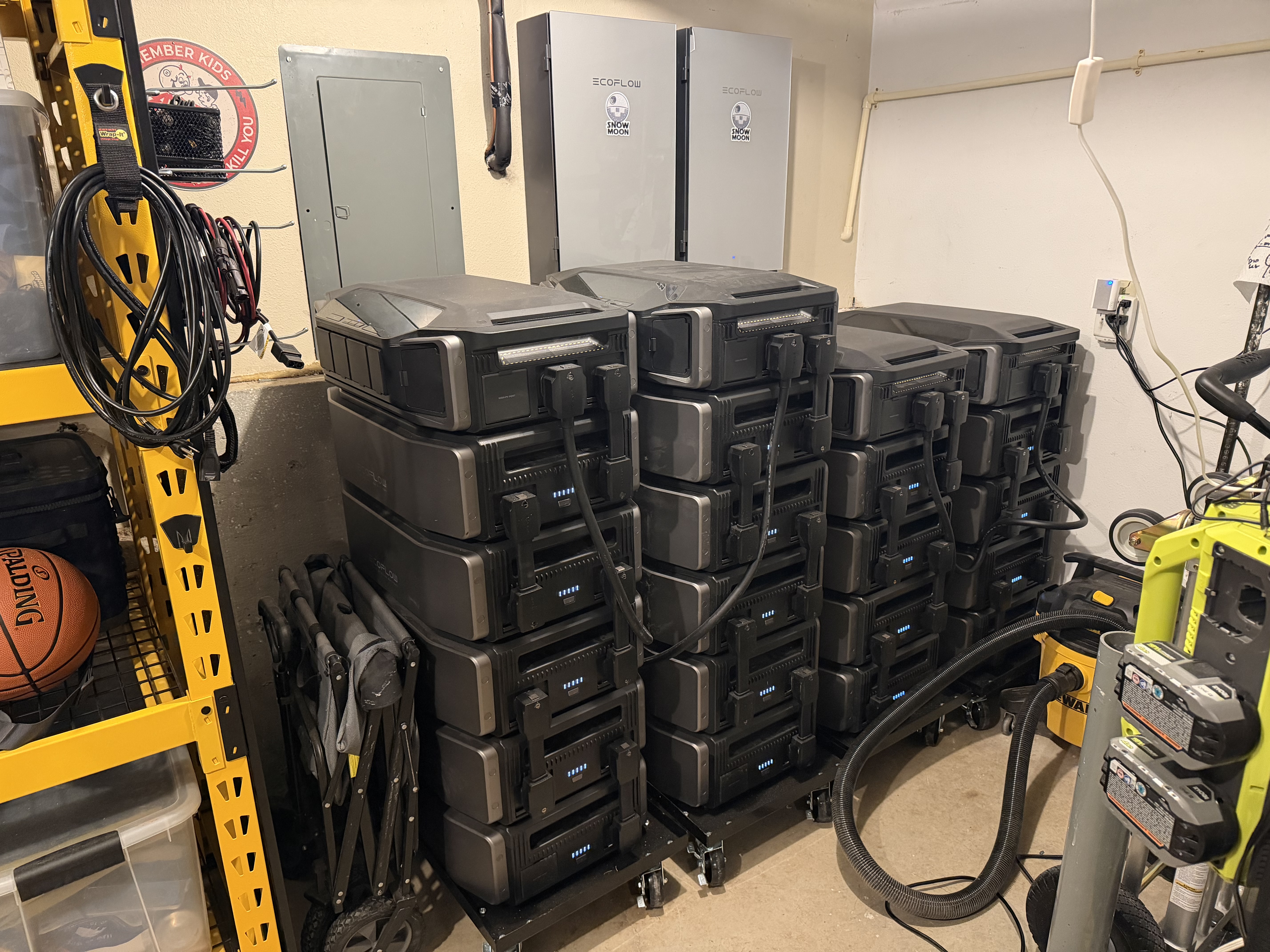 The finished Snow Moon build: a tall stack of EcoFlow Delta Pro Ultra batteries and inverters in the garage, labeled and wired into the whole-home backup setup.